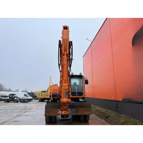 Колесен багер Doosan DX140W 2009